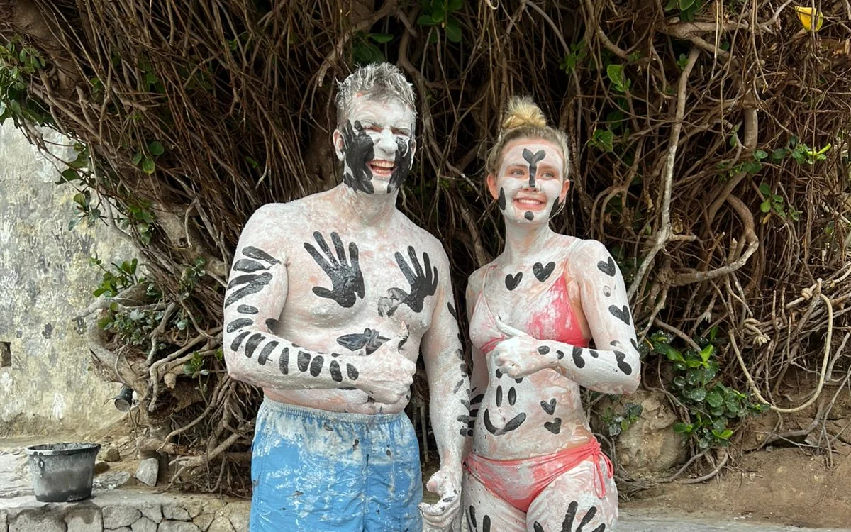 Guests enjoying the Sulphur Springs mud baths during a Soufriere land and sea adventure