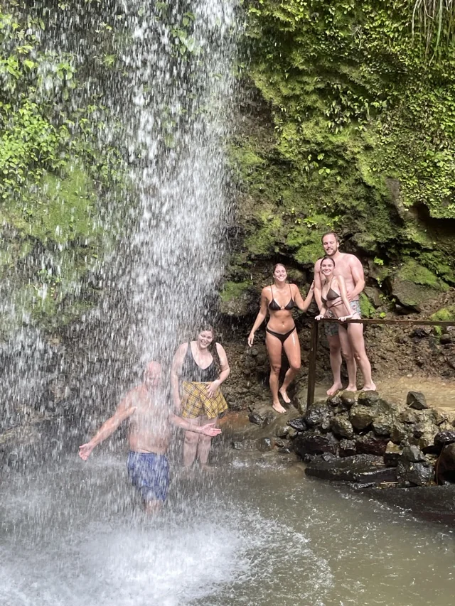 Guests enjoying a waterfall during their Soufrière land adventure